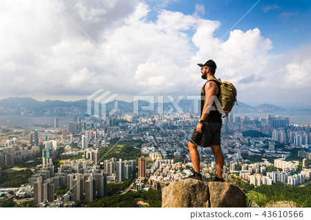 Man enjoying Hong Kong view from the Lion rock Man enjoying Hong Kong view from the Lion rock 43610566