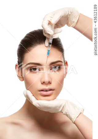 girl getting face injection isolated on white girl getting face injection isolated on white 43612189