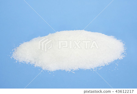 Monosodium glutamate on light blue background Monosodium glutamate on light blue background 43612217