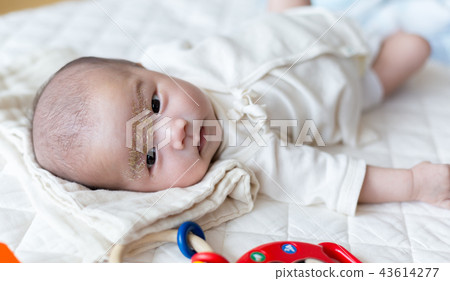 Smiling newborn baby 43614277