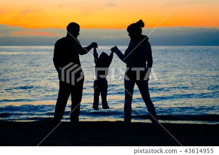 family at sunset by the sea family at sunset by the sea 43614955
