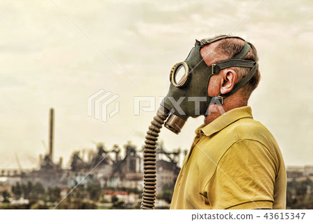 Person in gas mask. Grunge style toned image. 43615347