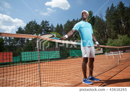 Happy man is having fun on court Happy man is having fun on court 43616265