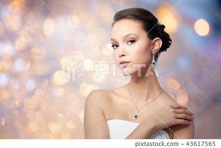 beautiful asian woman with earring and pendant 43617565
