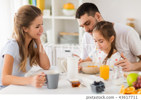 happy family having breakfast at home 43617711
