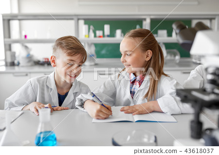kids studying chemistry at school laboratory 43618037