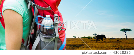 close up of woman with water bottle in backpack close up of woman with water bottle in backpack 43618225