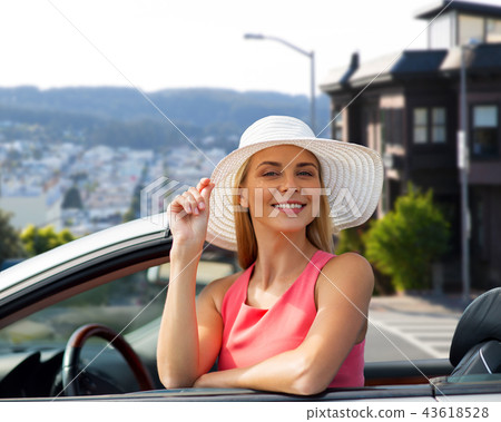 happy woman in convertible car over san francisco happy woman in convertible car over san francisco 43618528