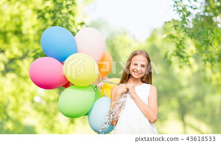 happy girl with balloons over natural background happy girl with balloons over natural background 43618533