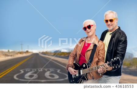 senior couple with electric guitar over route 66 senior couple with electric guitar over route 66 43618553