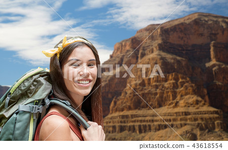 happy woman with backpack over grand canyon happy woman with backpack over grand canyon 43618554