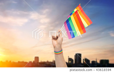 hand with gay pride rainbow flags and wristband 43618594
