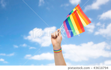 hand with gay pride rainbow flags and wristband hand with gay pride rainbow flags and wristband 43618794