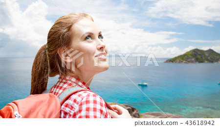 happy woman with backpack over seychelles island happy woman with backpack over seychelles island 43618942