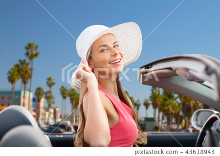 happy young woman in convertible car happy young woman in convertible car 43618943