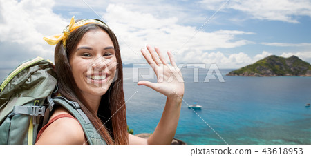 happy woman with backpack over seychelles island happy woman with backpack over seychelles island 43618953