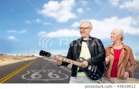 senior couple with electric guitar over route 66 senior couple with electric guitar over route 66 43619012