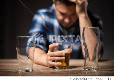 alcoholic drinking beer from glass at night alcoholic drinking beer from glass at night 43619015
