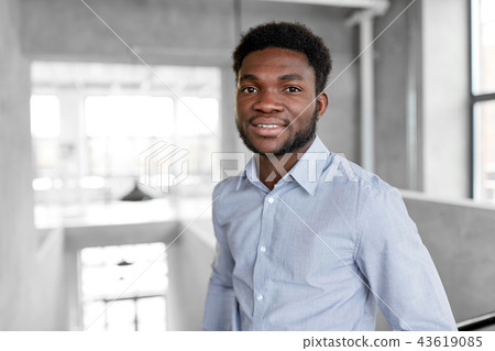 smiling african american businessman at office smiling african american businessman at office 43619085