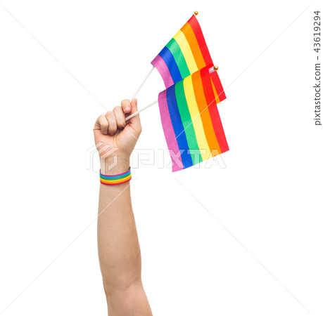 hand with gay pride rainbow flags and wristband 43619294