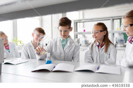 kids with test tube studying chemistry at school kids with test tube studying chemistry at school 43619338
