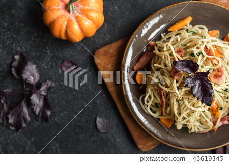 Autumn pasta with pumpkin and bacon Autumn pasta with pumpkin and bacon 43619345