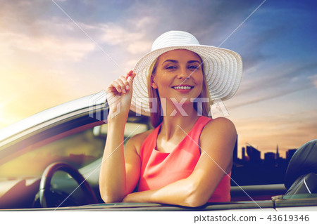 happy young woman in convertible car happy young woman in convertible car 43619346