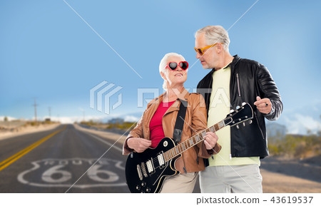 senior couple with electric guitar over route 66 senior couple with electric guitar over route 66 43619537