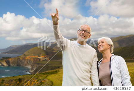 happy senior couple over big sur coast 43619587