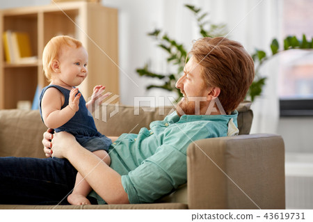 happy father with little baby daughter at home 43619731