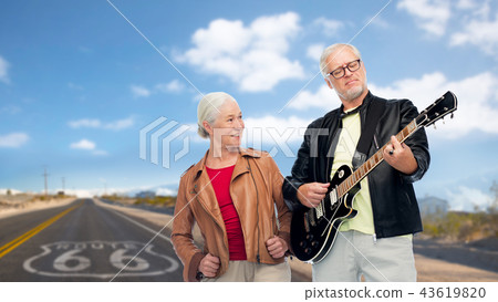 senior couple with electric guitar over route 66 senior couple with electric guitar over route 66 43619820