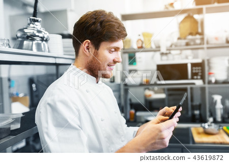 chef cook with tablet pc at restaurant kitchen 43619872