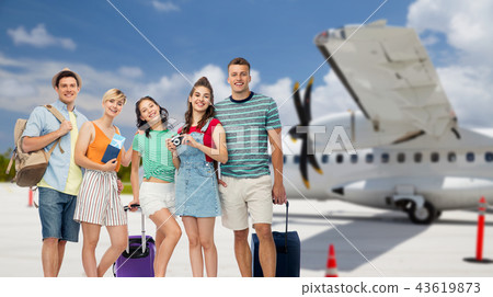 friends with travel bags and camera over airplane friends with travel bags and camera over airplane 43619873
