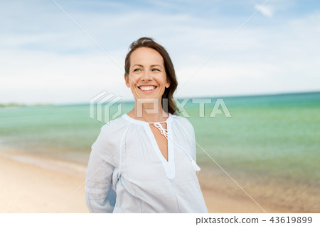 happy smiling woman on summer beach happy smiling woman on summer beach 43619899