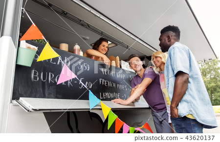 customers or friends and saleswoman at food truck customers or friends and saleswoman at food truck 43620137
