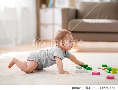 asian baby boy playing with toy blocks at home asian baby boy playing with toy blocks at home 43620178