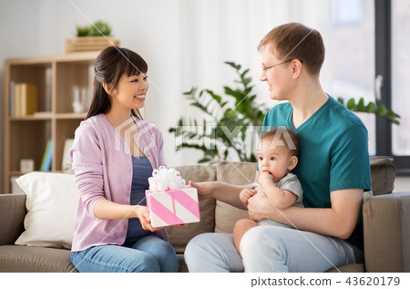 happy family with gift and baby boy at home happy family with gift and baby boy at home 43620179
