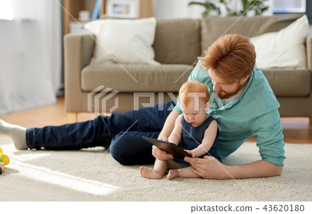 father and baby daughter with tablet pc at home father and baby daughter with tablet pc at home 43620180