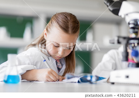 girl studying chemistry at school laboratory girl studying chemistry at school laboratory 43620211