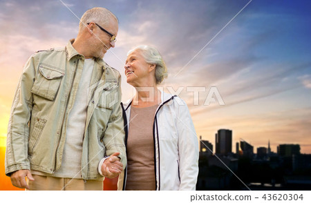 senior couple hugging over evening tallinn city 43620304