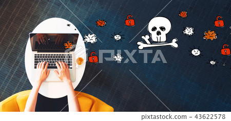 Virus and scam theme with person using a laptop 43622578