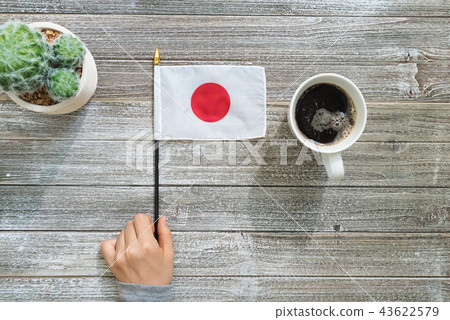 Japanese flag on a gray table Japanese flag on a gray table 43622579
