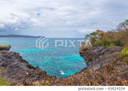 Blue caribbean sea and cliffs 43624334