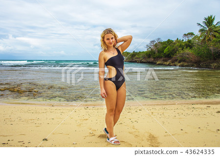 Young happy girl in black bikini  43624335