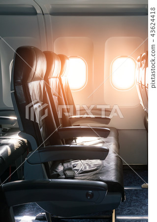 Empty seats and window inside an aircraft Empty seats and window inside an aircraft 43624418
