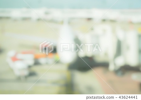 Blur background aircraft and loading area Blur background aircraft and loading area 43624441