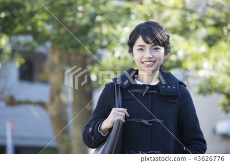 Woman in coat 43626776