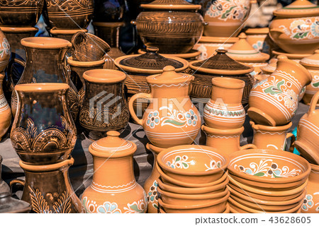 Clay dishes. Crockery made clay. Dishes background 43628605