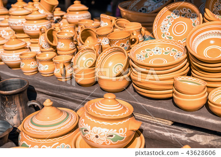 Clay dishes. Crockery made clay. Dishes background 43628606