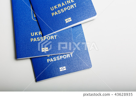 blue Ukrainian biometric passport with an identification chip on a white background blue Ukrainian biometric passport with an identification chip on a white background 43628935